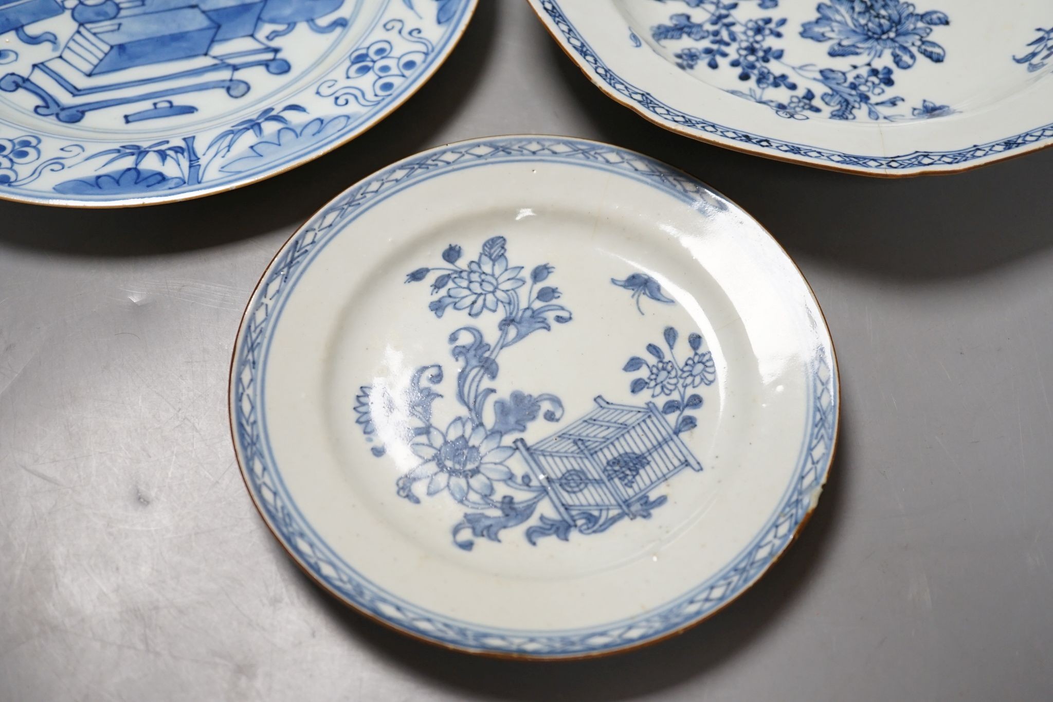 A Set of six 18th century Chinese export blue and white ‘bird in a cage’ small plates, 6.3 cm diameter and two pairs of 18th century Chinese export blue and white plates dishes, largest 23cm diam (10)